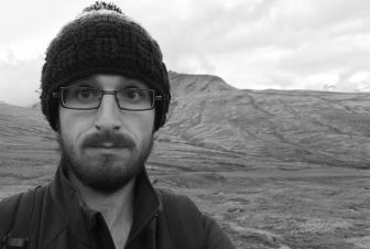 A male researcher on a hill